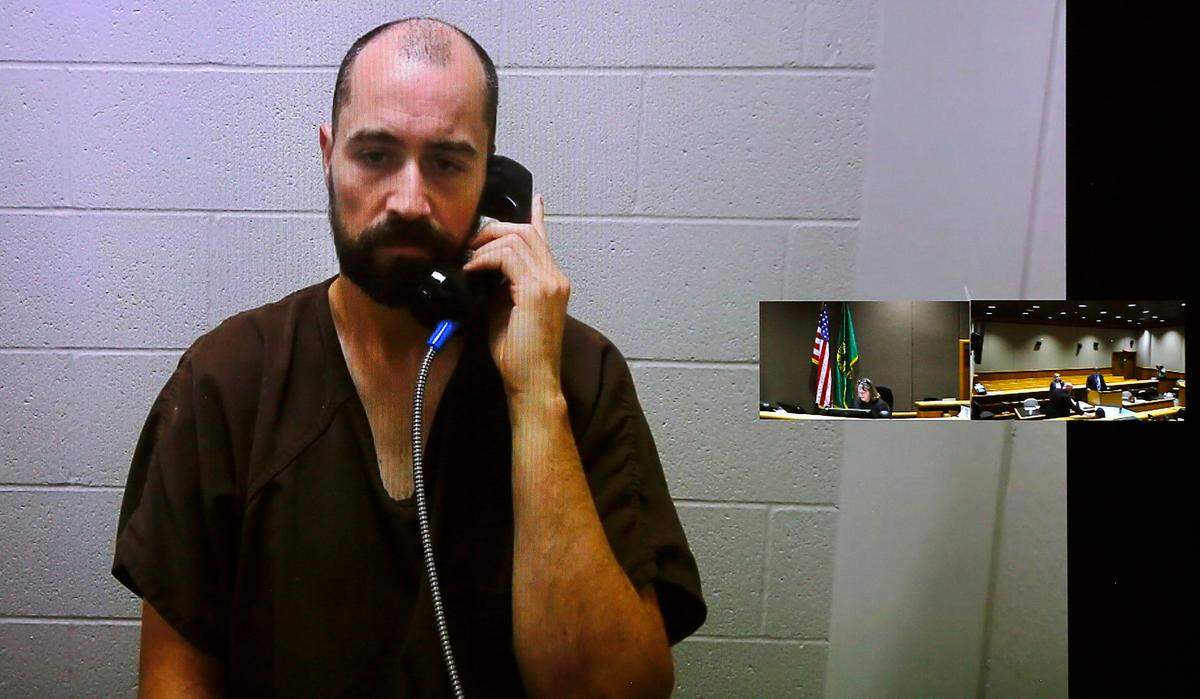 Therapist Michael T. Smith appears in Benton County Superior Court via a video link. He’s charged with the second-degree murder of his girlfriend, Jenna L. Olafson.