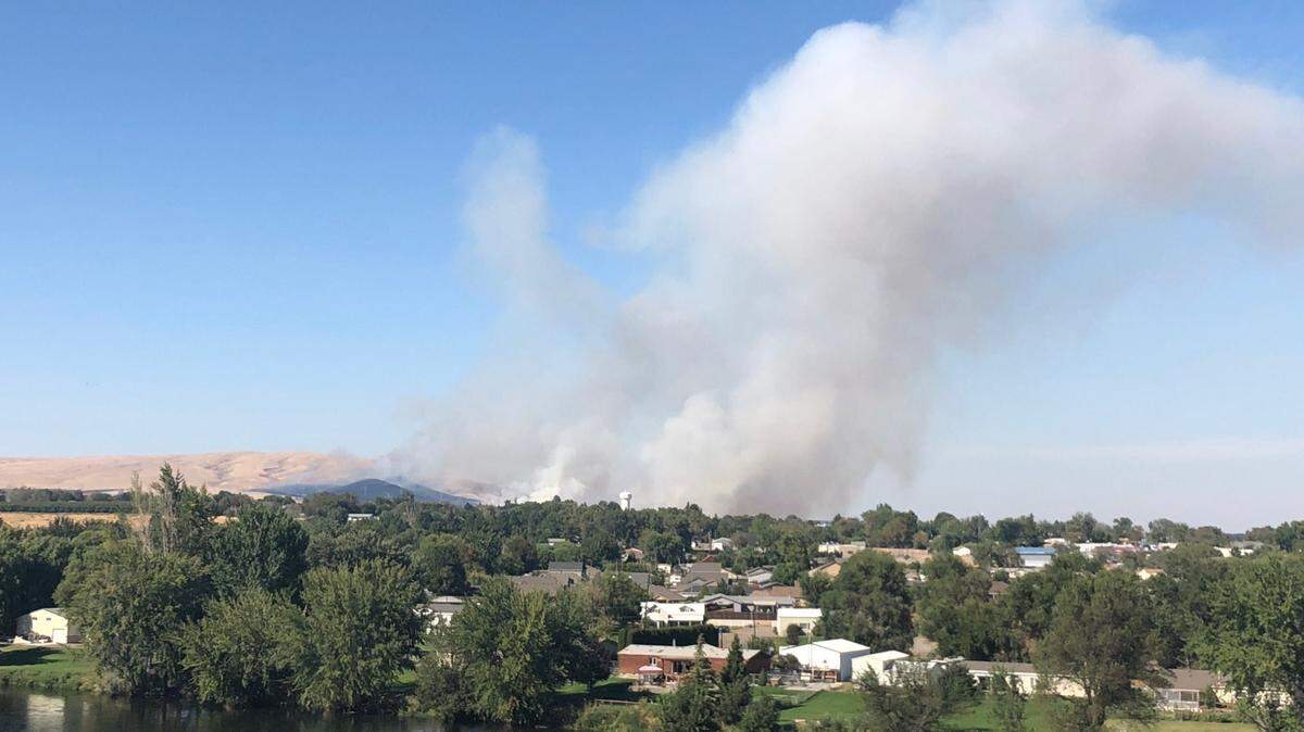 A large wildland fire is burning north of Benton City. It is visible from Interstate 82.