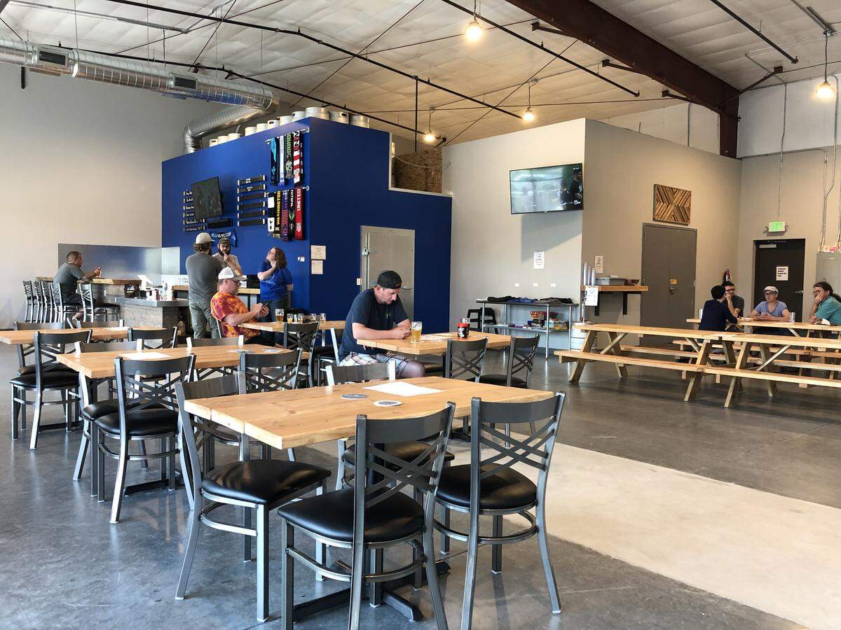Ryan Wattenbarger and Hilary Bird opened Moonshot Brewery in Kennewick Saturday.