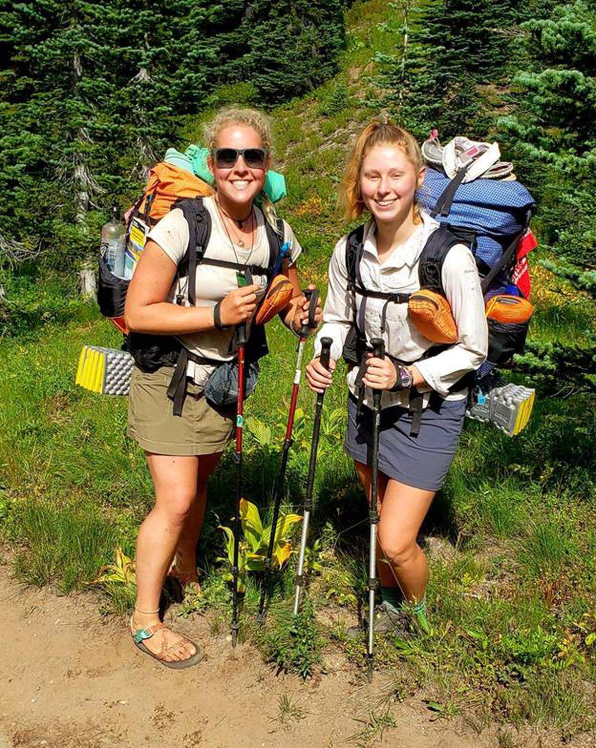 Two Pacific Trail through-hikers, with trail names Slip-N-Slide and Pop Tart, on the Pacific Crest Trail heading to Sourdough Gap north of Chinook Pass.