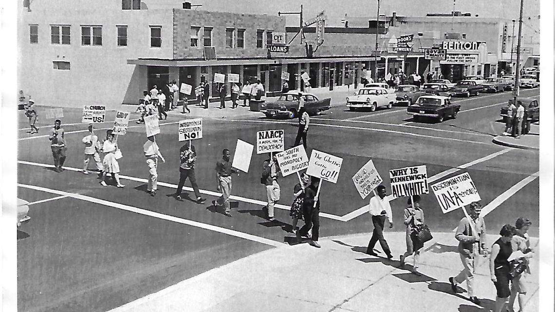 Protesters march through Kennewick in 1963 to draw attention to segregated housing in the Tri-Cities and policies that prevented Blacks from living in Kennewick.