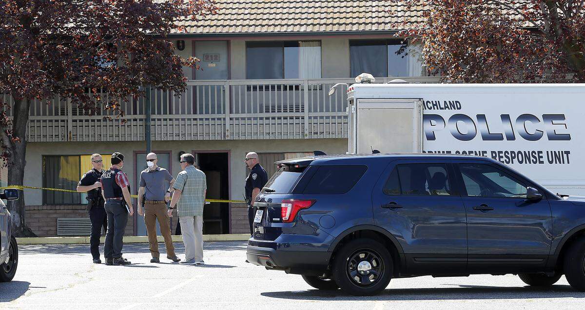 Richland police investigate a man found dead in a room at the Days Inn on Jadwin Avenue. Kennewick and Pasco police helped Richland officers track down two possible suspects and a stolen car. Watch a video at: tricityherald.com/videos