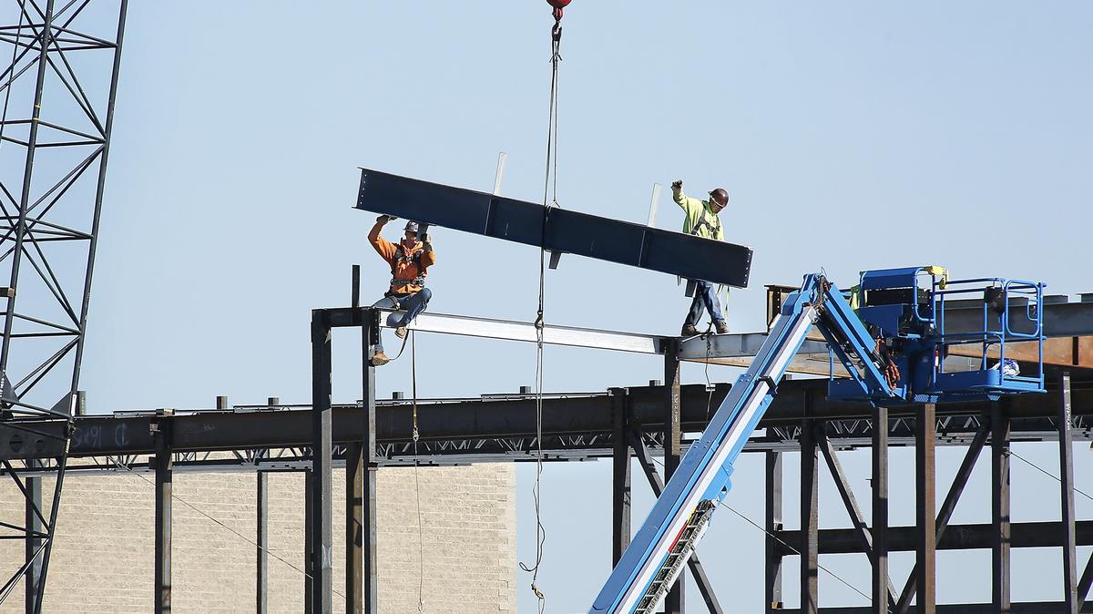 Workers guide beams into place Tuesday for an addition at Amistad Elementary School in Kennewick. The first phase of the renovation includes 22 classrooms, a gym and office space next to the school built in 1992 at 930 W. Fourth Ave. The $18 million project is to open in August 2019 and is being paid for by a state K-3class size reduction grant. Voters still need to approve a second phase to replace the existing school.