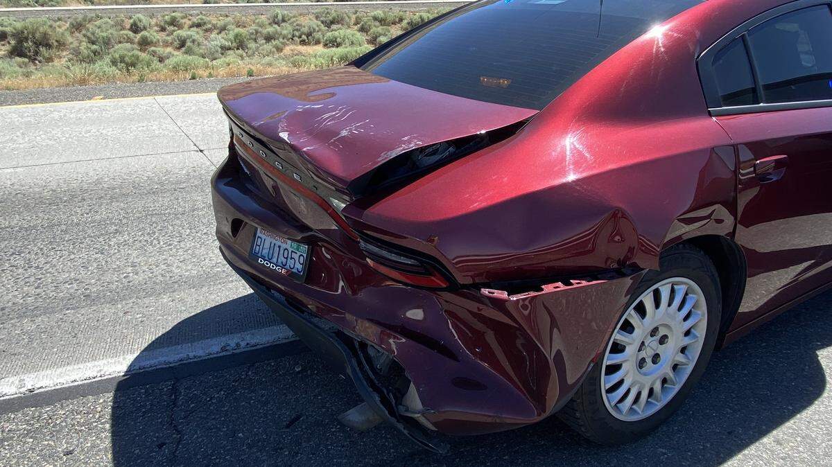 An unmarked Washington State Patrol car was hit during a three-car collision on Interstate 182 in Richland.