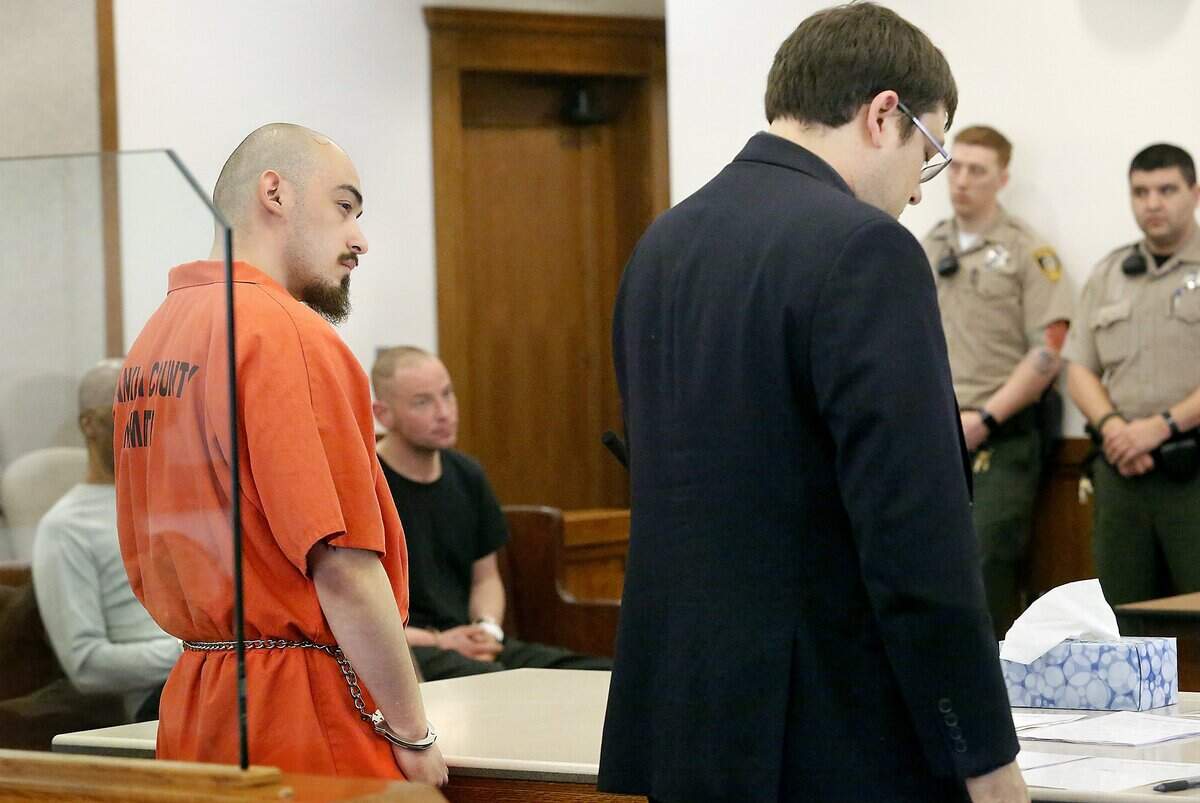 Murder suspect Daviel Davis Canela, left, standa with provisional attorney Ian Sinclair Friday afternoon during his probable cause hearing in Franklin County Superior Court. Judge Cameron Mitchell found there was grounds to hold Canela for 72 hours in connection with Thursday's fatal shooting of a man outside an apartment building in the 800 block of West Ruby Street in Pasco.