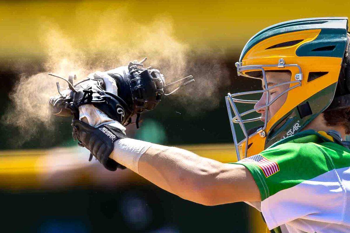Richland catcher Hayden Galloway snatches a pitch at home plate during opening-round play against the Skyline Spartans at the WIAA 4A State Baseball Championships Saturday at Bomber Bowl in Richland.
