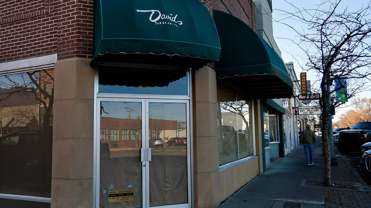The inside of the windows are covered with paper at the former David’s Shoes store in downtown Kennewick.