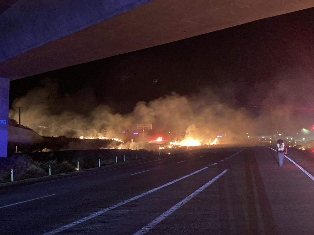 A wildfire likely caused by a semi having a mechanical issues damaged storage units and parked vehicles off Interstate 82 near Highway 395 in Kennewick.
