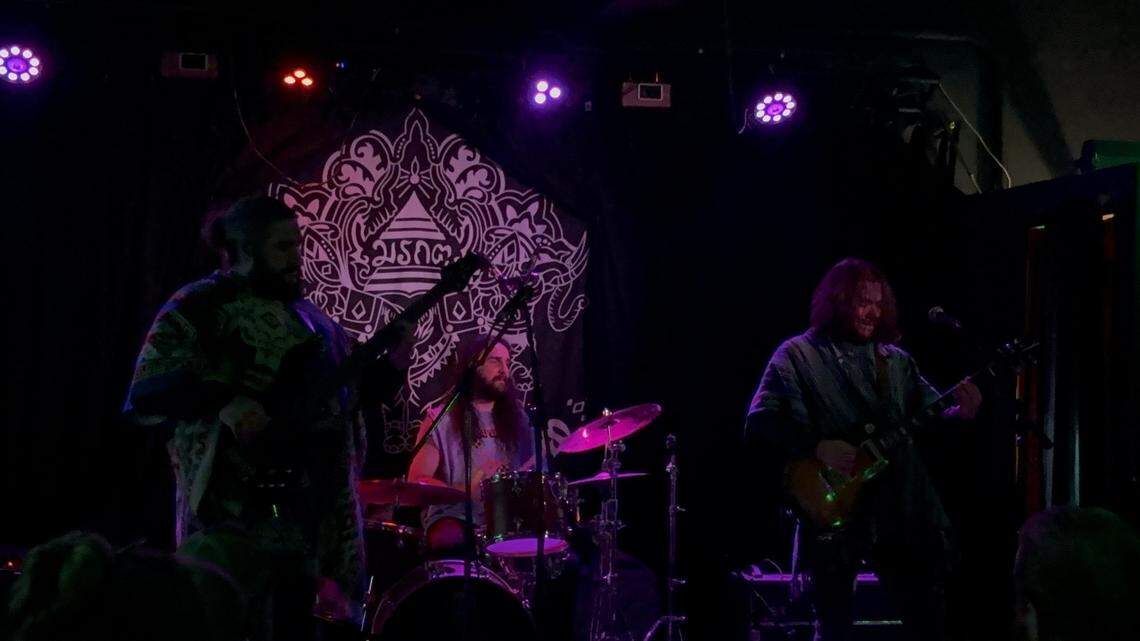 Carson Garland, center, plays drums for Cadejos at The Emerald of Siam on November 16, 2024.