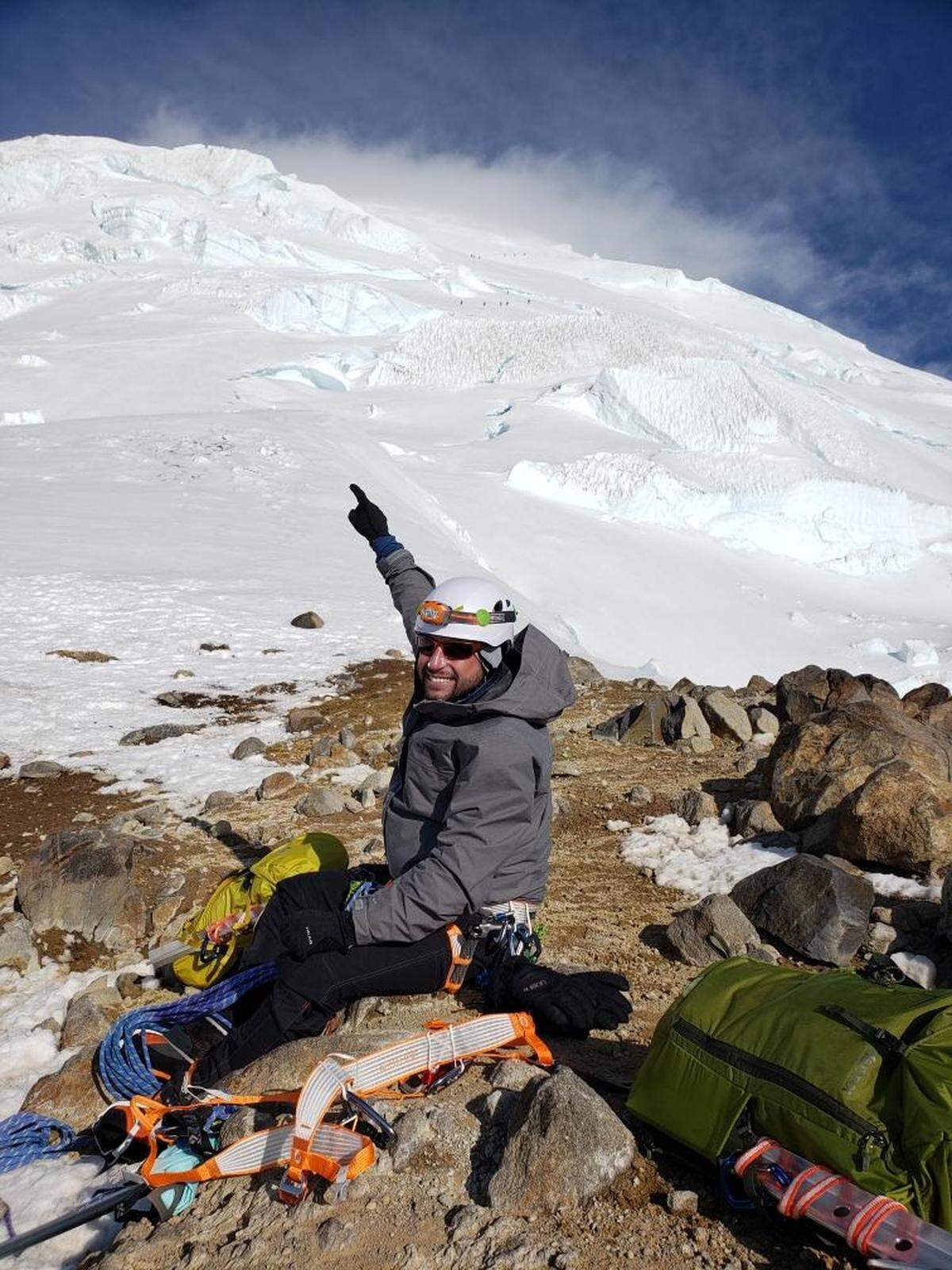 Ross Craig resting for a moment as he climbs Mt. Rainier.