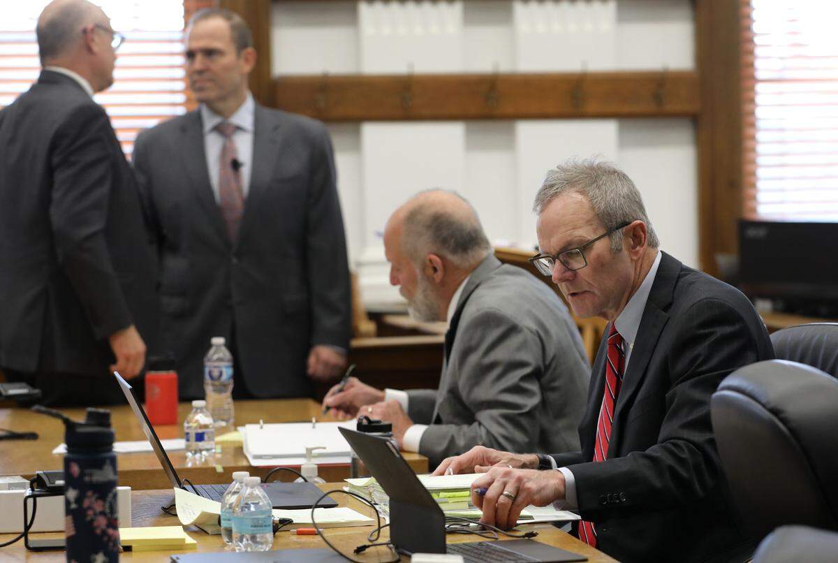 Benton County attorney Andrew Cooley, right, and plaintiff attorney team James Meade, Eron Cannon and Ronald B. Leighton, from left, prepare for the start of the second day of trial Thursday morning in a Walla Walla courtroom. A Walla Walla jury will decide if Benton County deputies deserve millions after alleged retaliatory conduct by the former sheriff tied to 2019 events and recall.