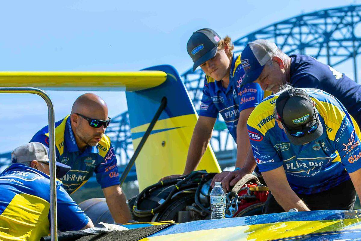Crew members with the U-11 Miss FLAV-R-PAC hydroplane review performance and make adjustments following a test run on the Columbia River during spring testing on Saturday in Kennewick. Teams use data gathered during testing to fine-tune their boats ahead of the Tri-City Water Follies and Columbia Cup races in July.