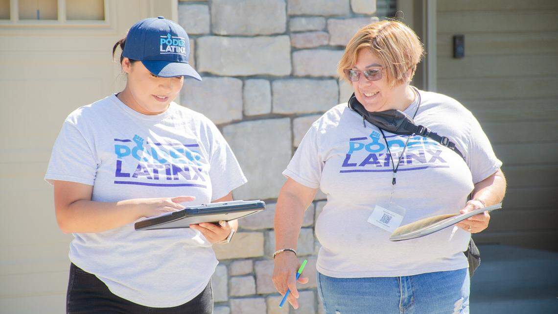 Poder Latinx canvassers, Nancy Cruz, left, and Cynthia Bruno, right, knock on doors Sept. 3 in a West Valley, Wash., neighborhood during a nationwide voter registration and mobilization effort in key Latino communities, including in the Yakima Valley.