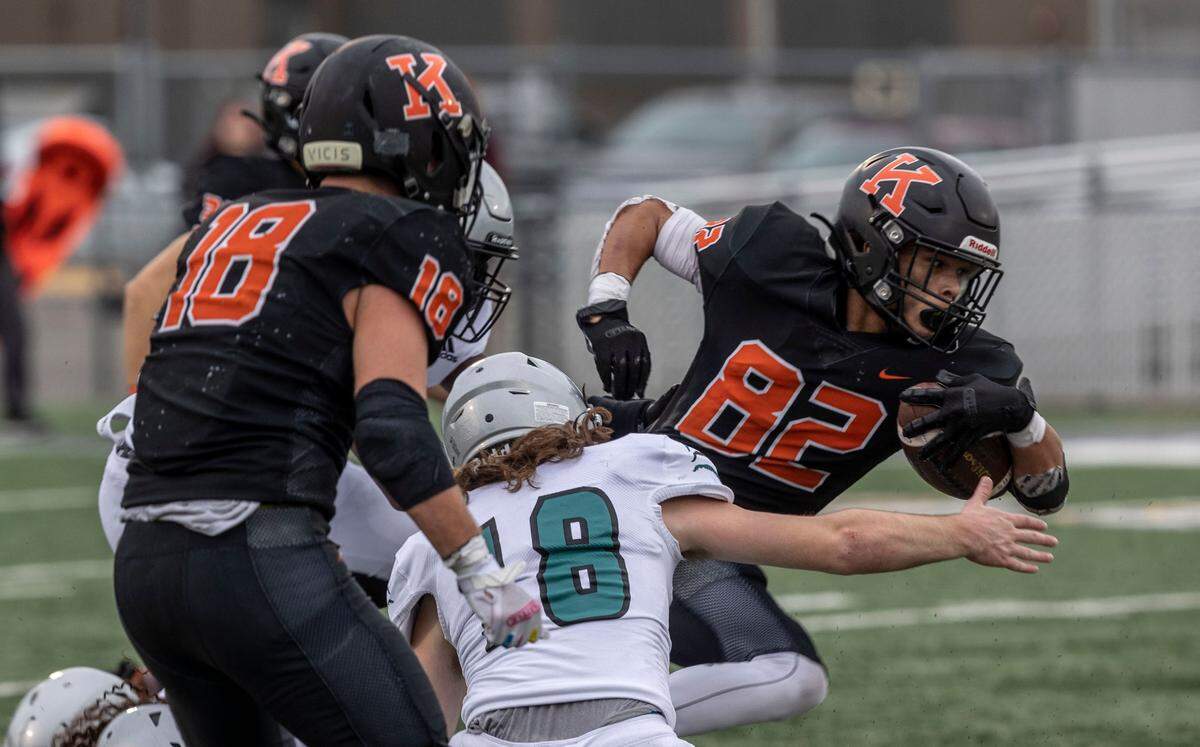 Senior Simeon Howard fights Spanaway Lake Sentinels defense during the 3rd quarter of the 3A state playoffs game at Lampson Stadium in Kennewick on Saturday.