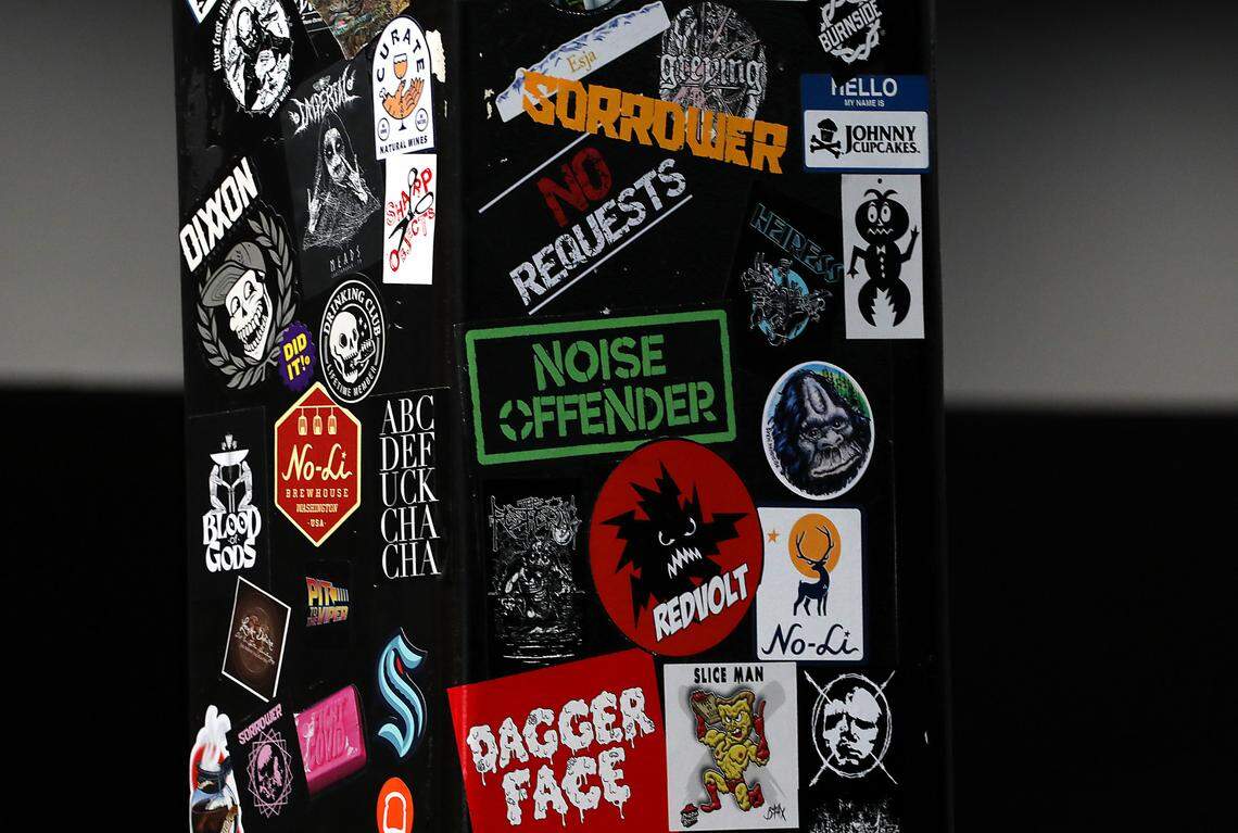 A variety of sticker cover a metal support beam inside the renovated Ray’s Golden Lion in Richland.