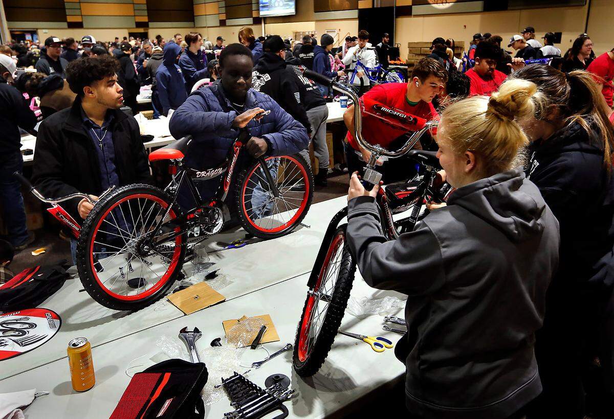 Students from Tri-Tech Skills Center join more than 600 volunteers at the 13th annual Bikes for Tikes bike build event at the Three Rivers Convention Center in Kennewick. The volunteers assembled 1,600 bicycles in about four hours for children in need throughout the Mid-Columbia. The Bikes for Tikes organization was founded in 2009 by the Plumbers & Steamfitters UA Local 598 and through this year have donated more than 18,500 bicycles.