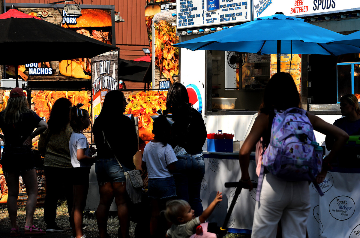 Fair food fans wait for the orders during lunch time at the 2023 Benton Franklin Fair & Rodeo at the fairground in Kennewick.