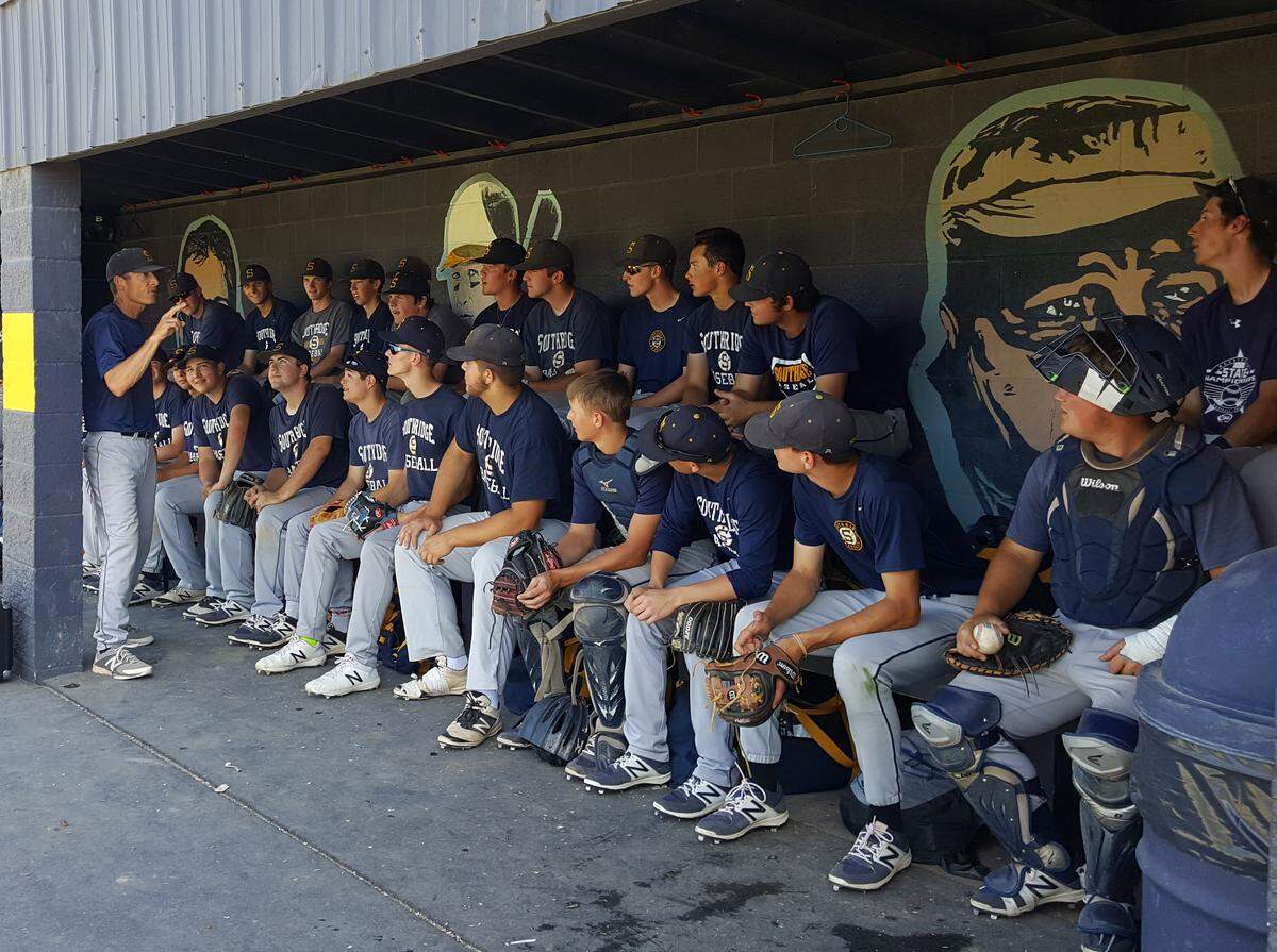 Southridge coach Tim Sanders (far left) addresses his team in 2018. (File photo)