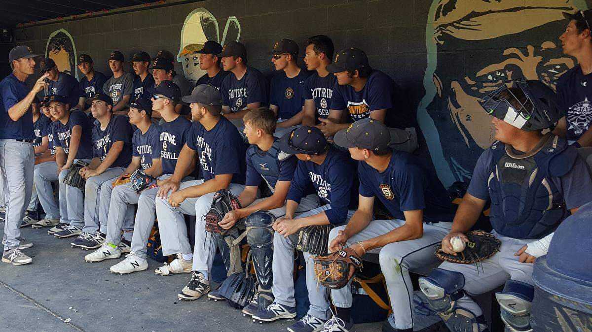 Southridge coach Tim Sanders (far left) addresses his team in 2018. (File photo)