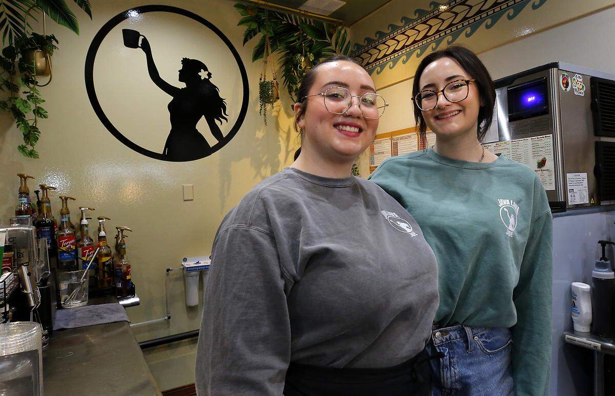 Ava Rodriguez, left, and her sister, Kennah, are part of a trio of sisters that recently started operating Java Lava Joe drive-thru coffee shop on Columbia Drive in Kenewick. 