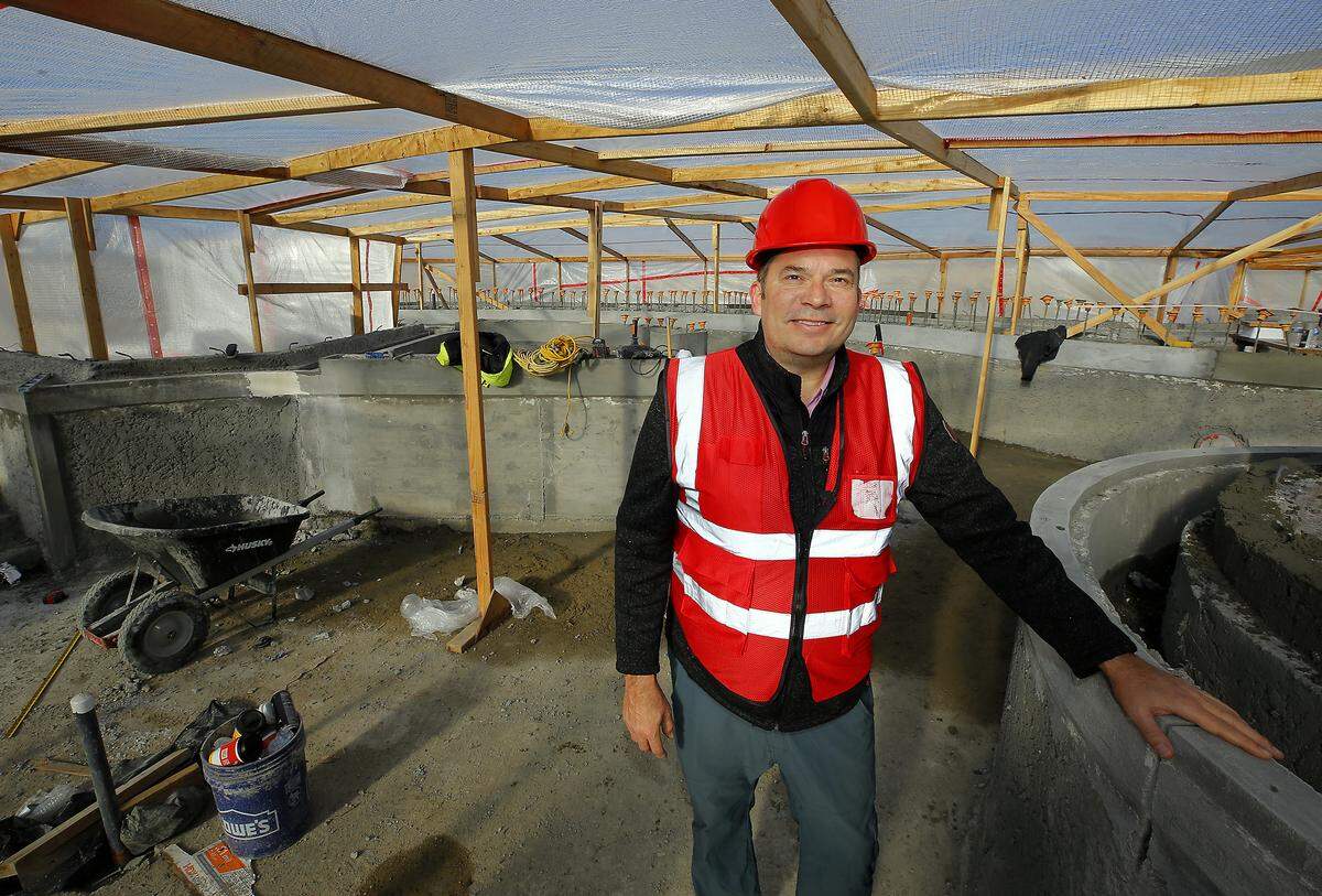 Matt Watkins, Pasco Public Facilities District executive director, stands in the unfinished lazy river section of the Pasco Aquatic Center.