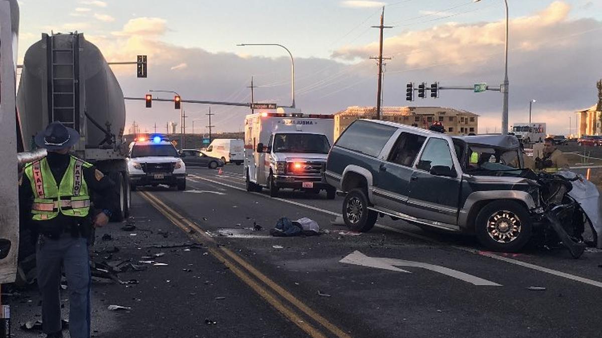 A car hit a semi truck at the intersection of Highway 240 and Kingsgate Road in Richland, blocking the highway.