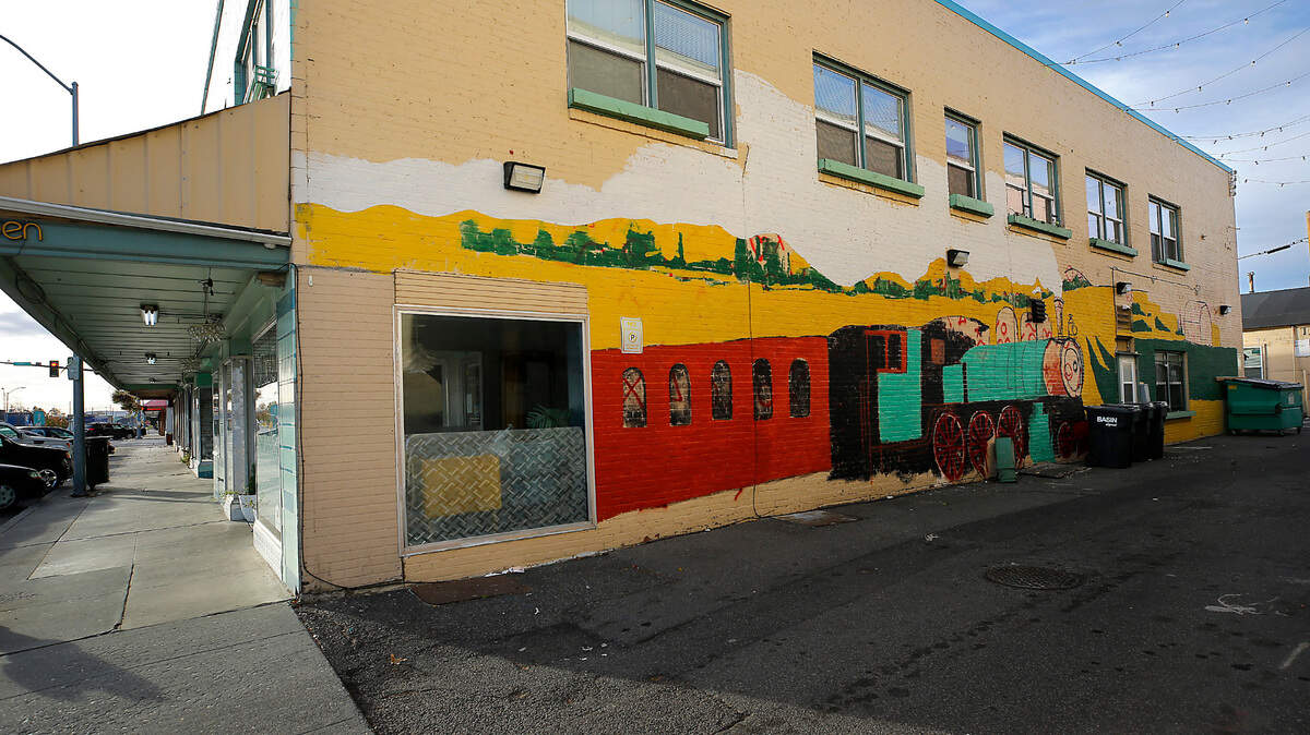 A new mural with a railroad theme started by artist Cameron Milton is coming to life on this brick wall in downtown Pasco.