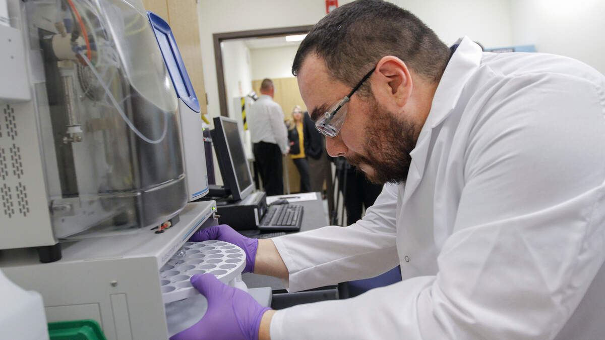 Andrew Killgore, a Hanford vitrification plant chemist, works at a lab at Columbia Basin College, where processes and procedures are being developed for the $17 billion plant being built to glassify radioactive and hazardous chemical waste.