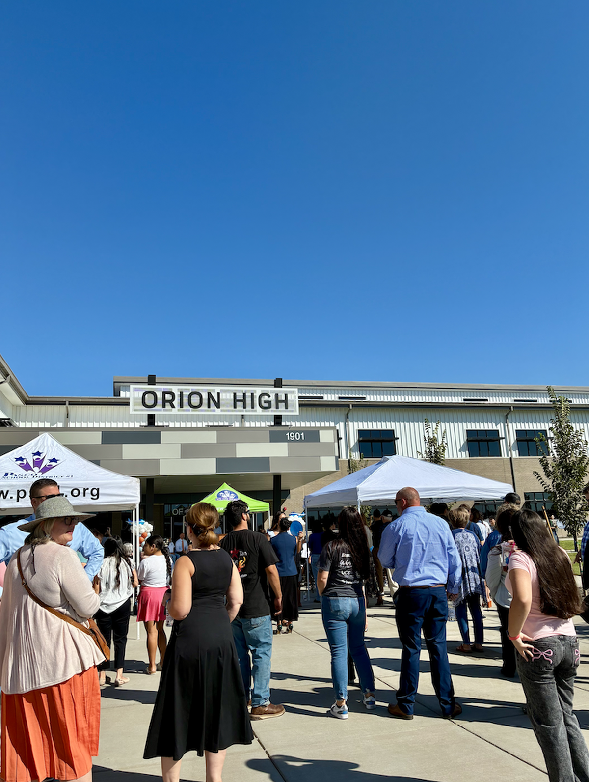 Families, students, and community members gather outside Orion High School ahead of its grand opening on Aug. 19 in Pasco.