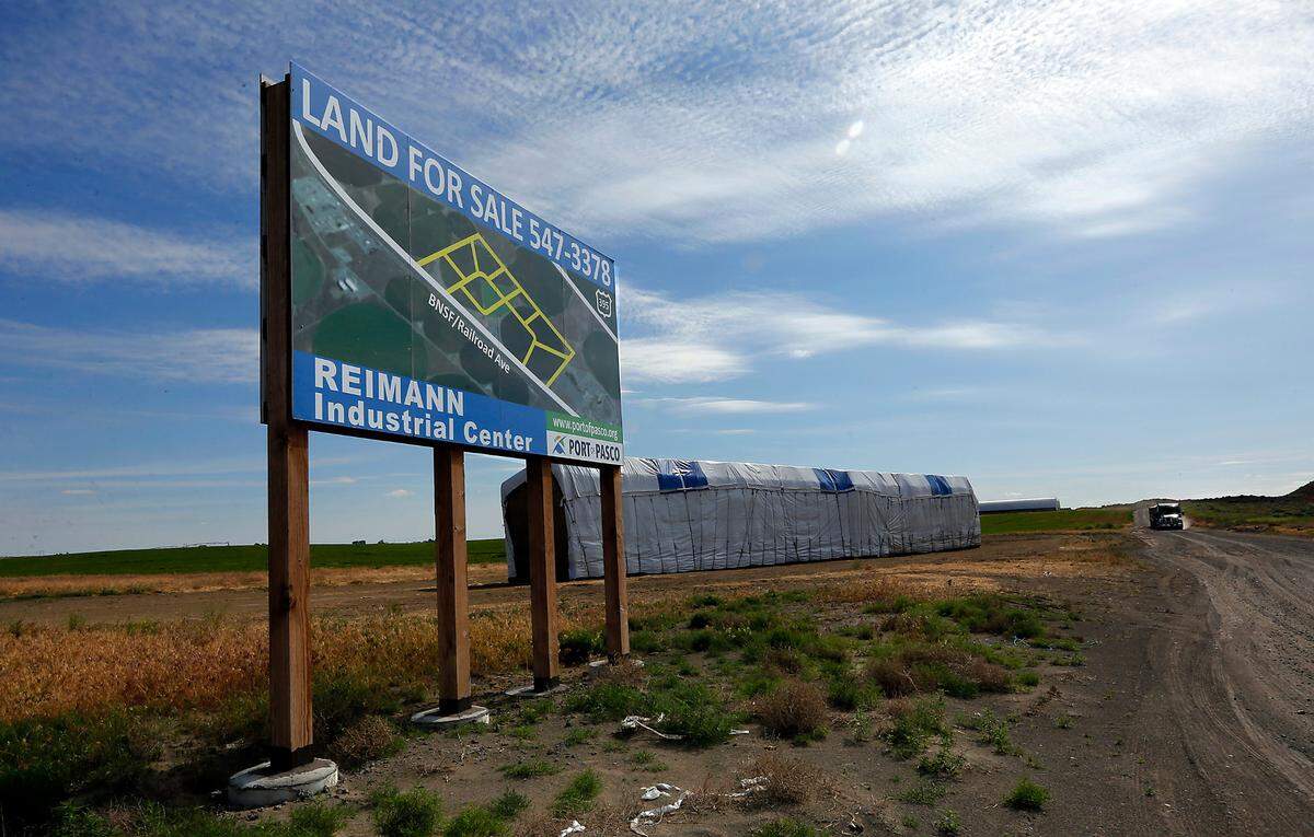 The Port of Pasco commission approved a deal to sell 150 acres of the 300-acre Reimann Industrial Center to Darigold.