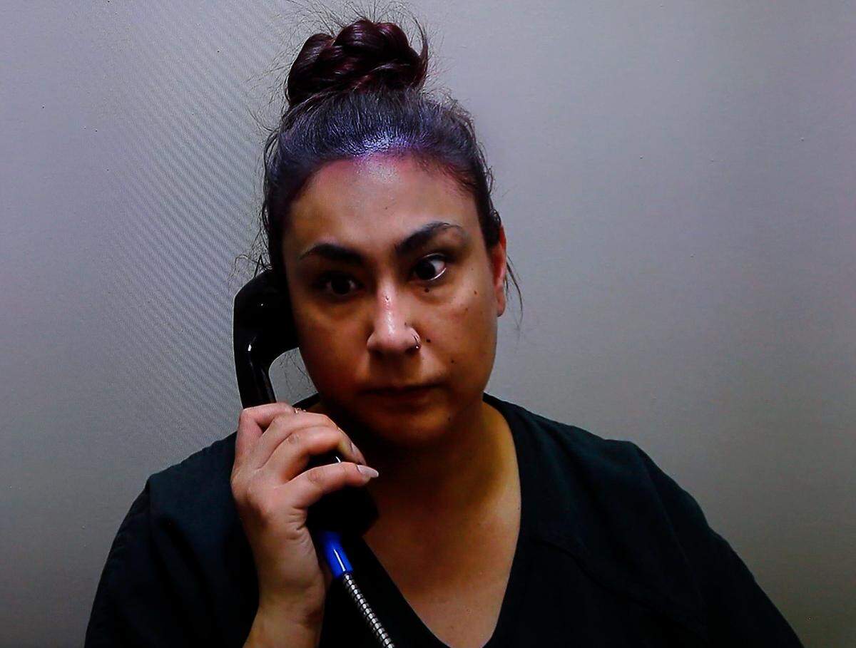 Rebecca Chavez, 31, makes her preliminary appearance in Benton County Superior Court via a video link from the jail after she was arrested for allegedly rendering criminal assistance.