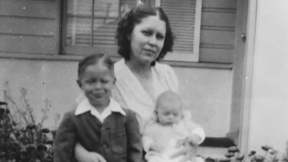 In tough times, Lucy Luginbill wishes she could still sit on her mama’s lap like she did in this early picture with her brother, Bruce.