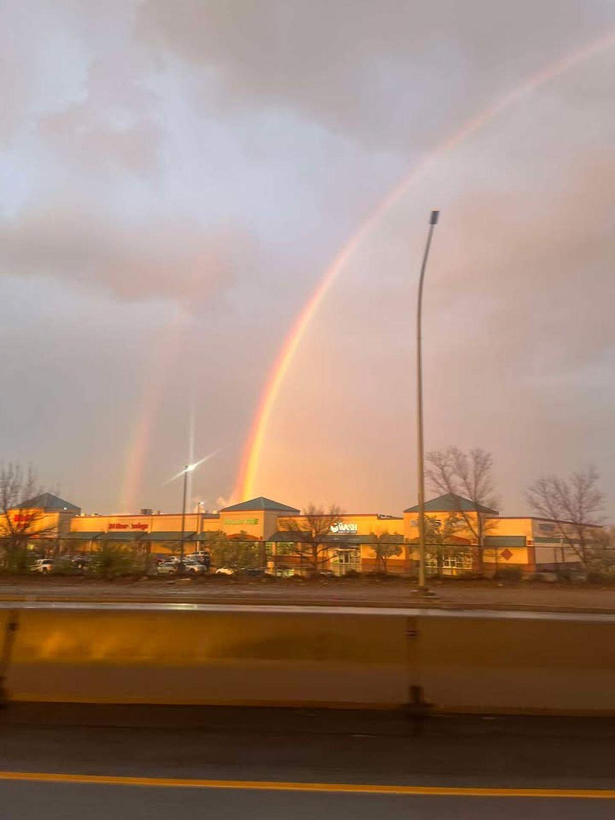 A rainbow over a Tri-Cities shopping center.