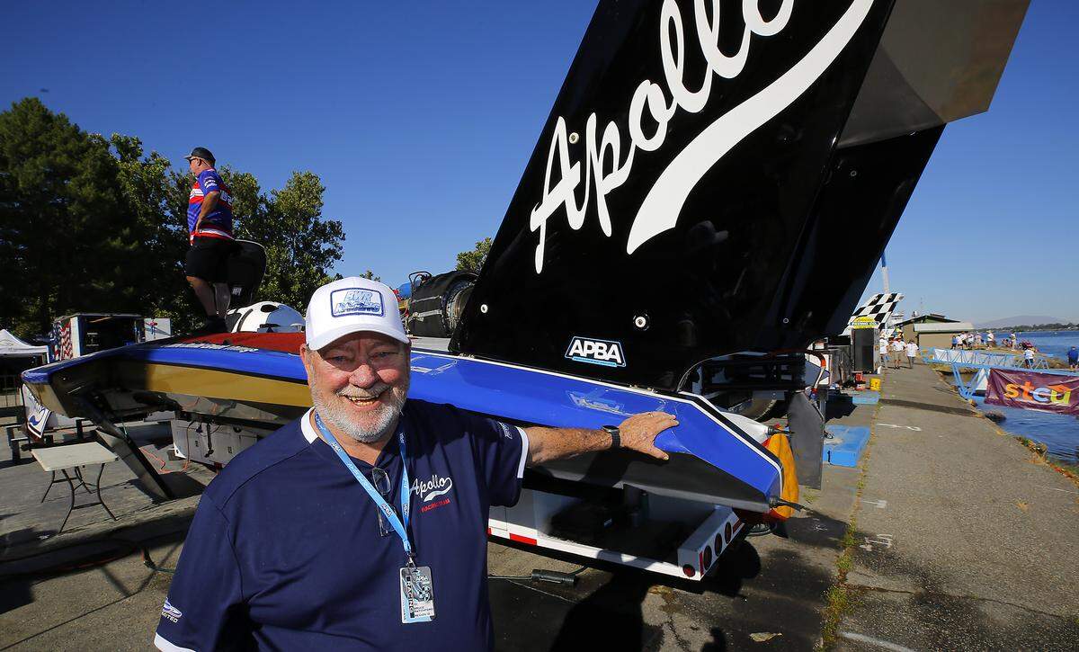 Bruce Ratchford stands next to one of his two unlimited hydroplane racing boats competing this weekend at the Apollo Gold Cup race in the Tri-Cities. 