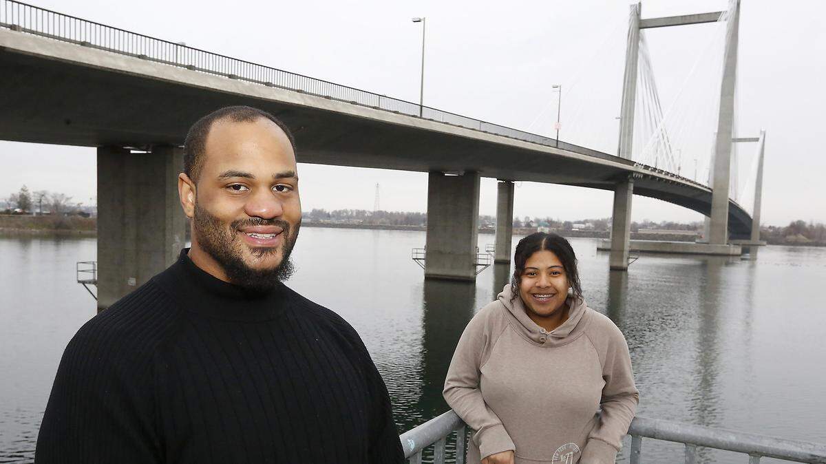 Davion Campbell, left, and his sister, Kyliyah Davis, stopped a woman from trying to kill herself by jumping from the cable bridge.