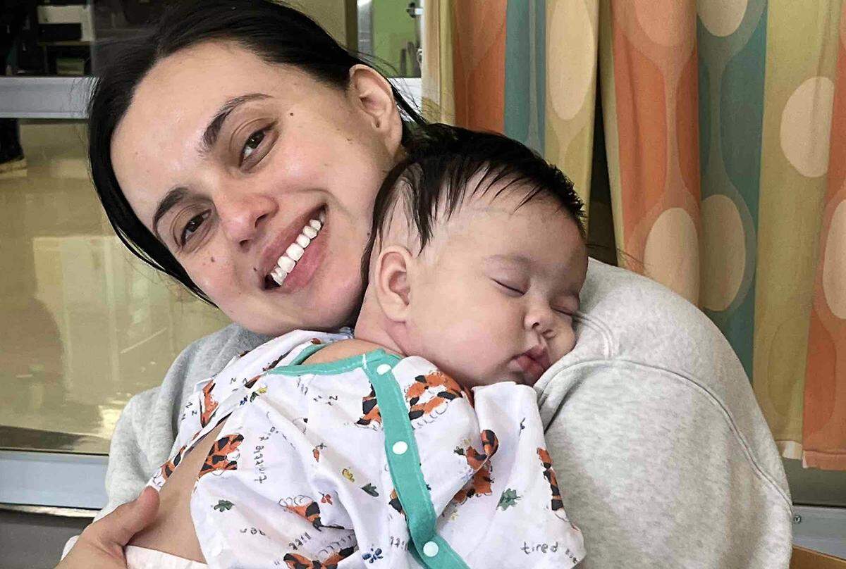 Florita Sanchez, of Pasco, holds daughter Lucia, who is being treated for a rare pediatric liver cancer at Seattle Children’s hospital.