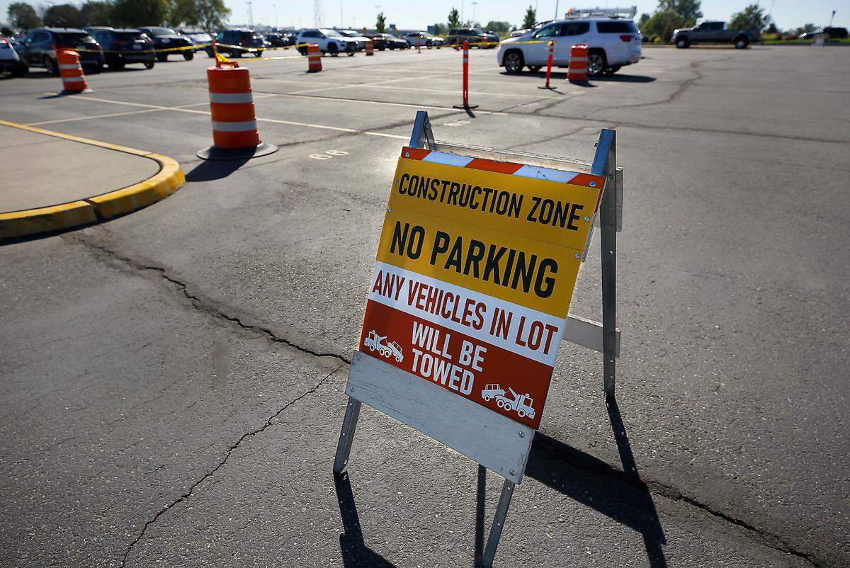 Signs and caution tape block off rows in the long term parking lot at the Tri-Cities Airport for planned repairs at the Pasco facility.