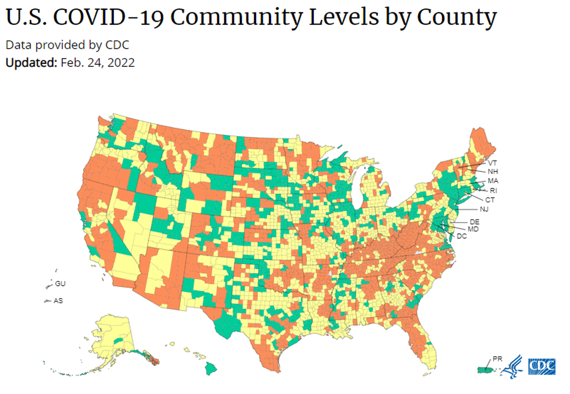 The Centers for Disease Control shows low rates of COVID-19 in green, medium rates in yellow and high rates in orange.