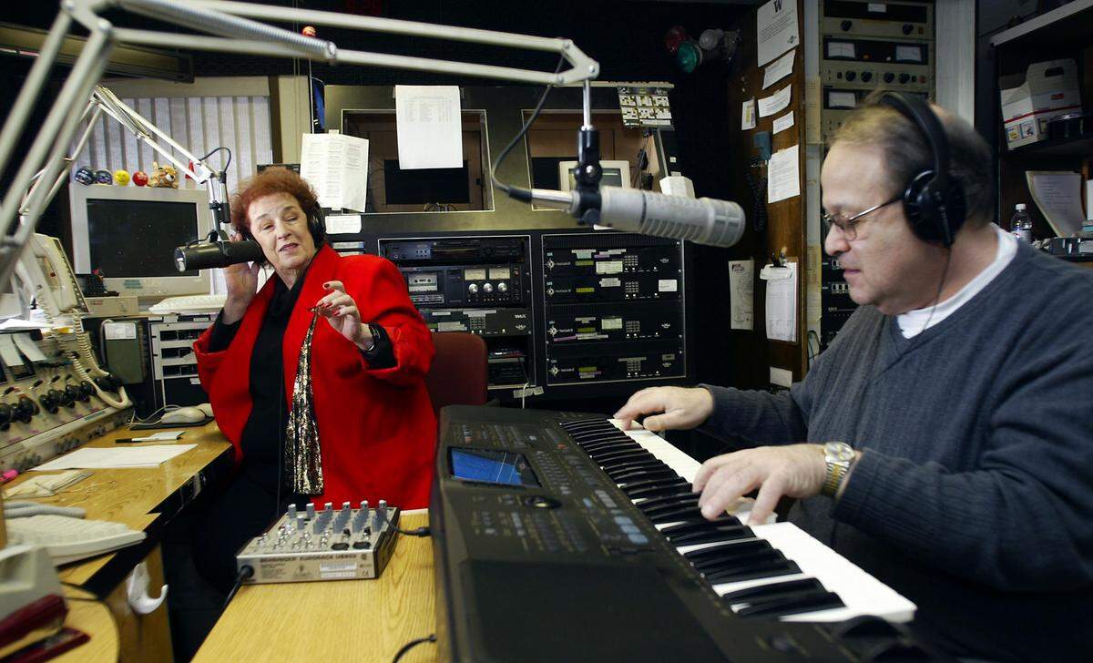 Mary Lou Gnoza and Steve Haberman rehearse a song in 2006 at the KONA radio station in Pasco. The pair were preparing for the start of hosting a radio show.
