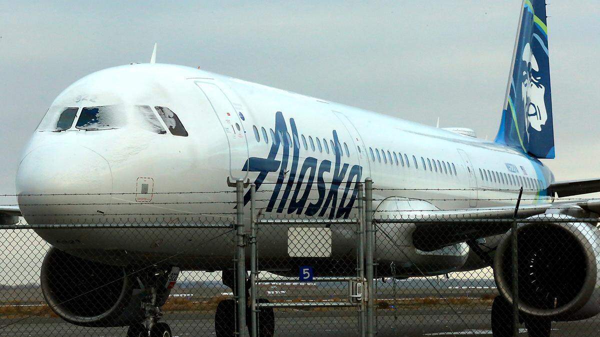 Snow clings to the cockpit windows on one of two Alaska Airlines jet planes sitting on the Tri-Cities Airport tarmac Monday morning after being diverted to Pasco Sunday night, according to Tri-Cities Airport Director Buck Taft. The diversions came as the Seattle-Tacoma International Airport was forced to cancel 364 flights because of winter weather.