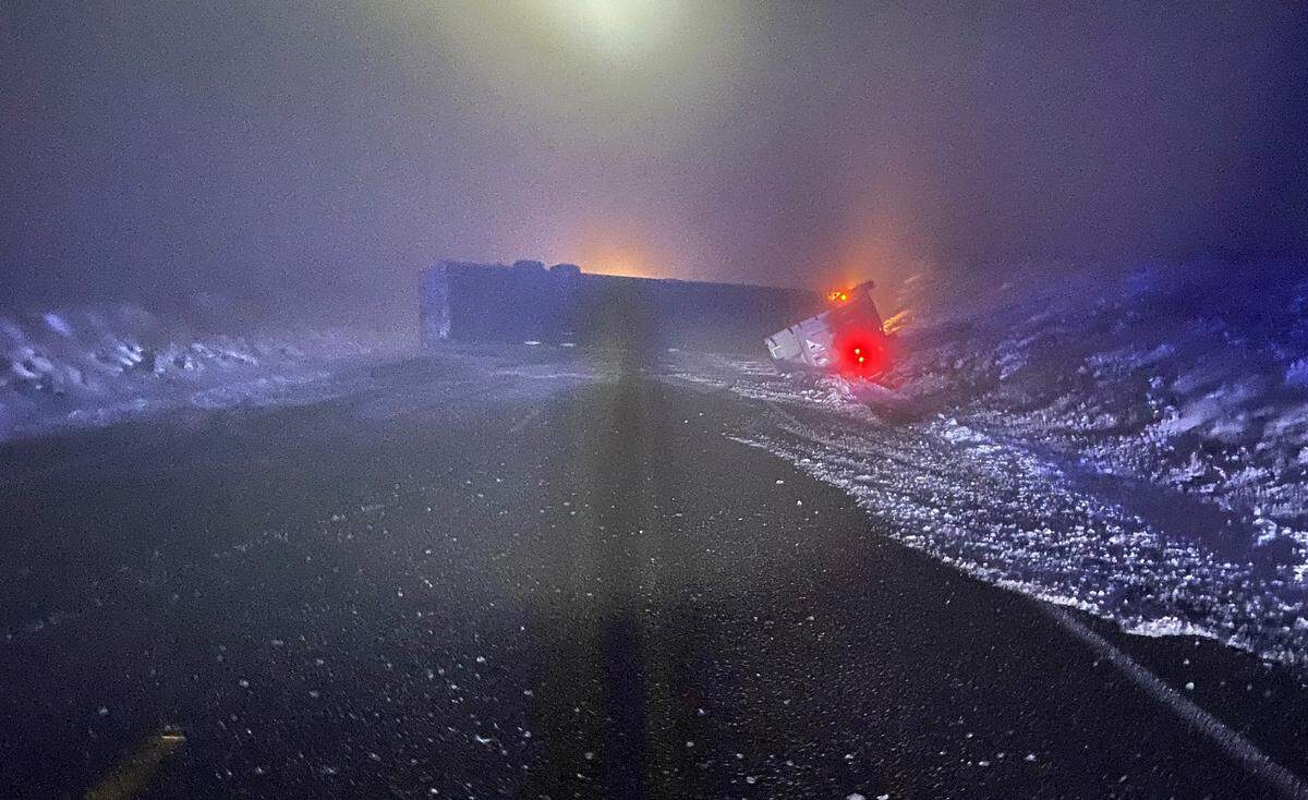 Locust Grove Road was closed west of Clodfelter Road as crews worked clearing a flipped semi-truck from the icy roadway near Glenn Miller Hill.