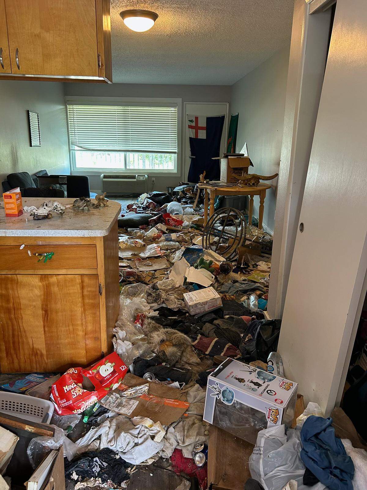 Two dogs and dead birds were found in a College Place apartment in Walla Walla County that was strewn with garbage and dried feces, according to police.