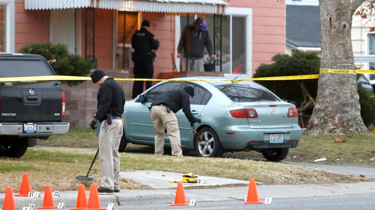 Richland police investigators search for and document evidence outside the duplex in the 300 block of Goethals Drive where a 21-year-old Emilio M. Elizondo was fatally shot.
