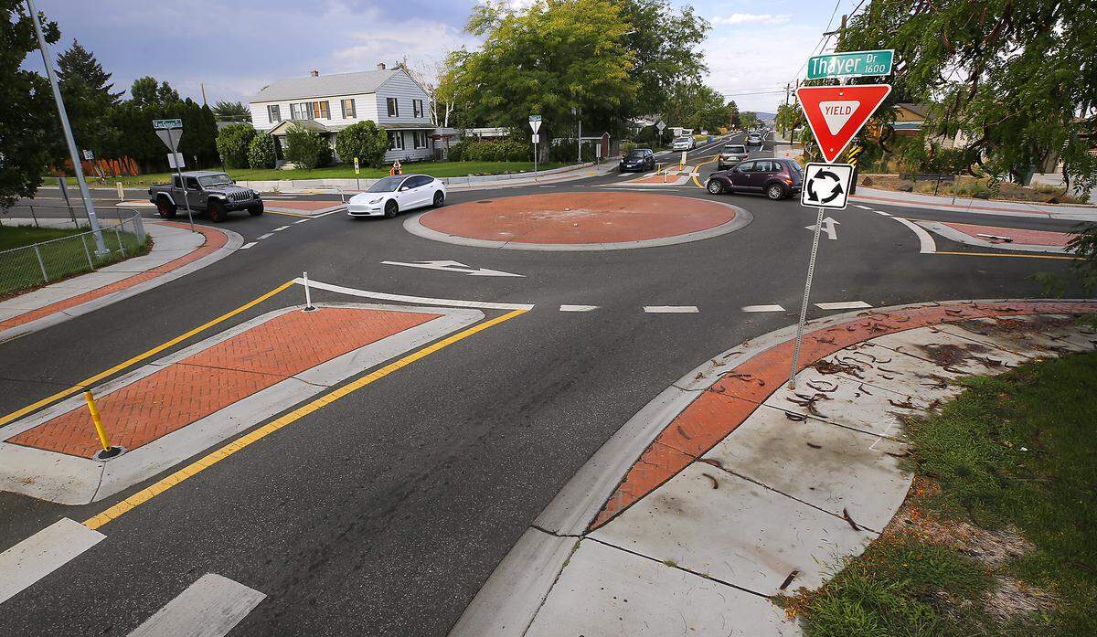 Traffic drives through the roundabout on West Van Giesen Street at Thayer Drive.