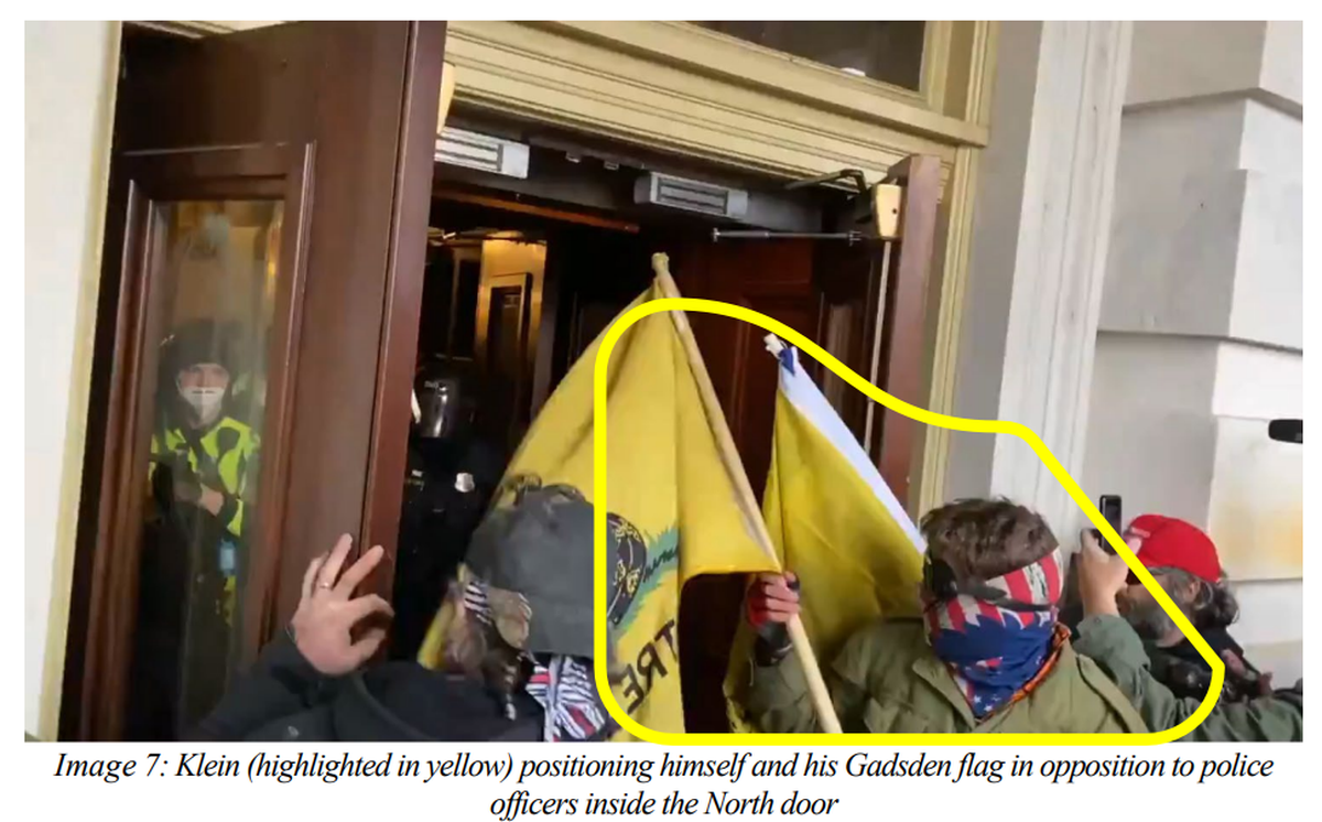 Matthew Klein, of Pendleton, Ore., is seen just before allegedly attempting to attack U.S. Capitol Police with a flag pole during the Jan. 6 riots.