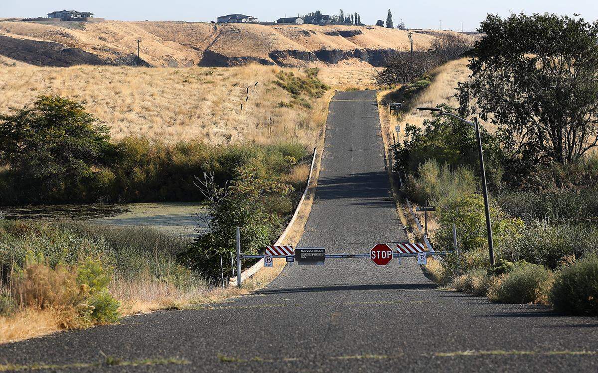 A locked gate for Levey Park blocks the road leading to the closed U.S. Army Corps of Engineers park on the Snake River in rural Franklin County, northeast of Pasco.