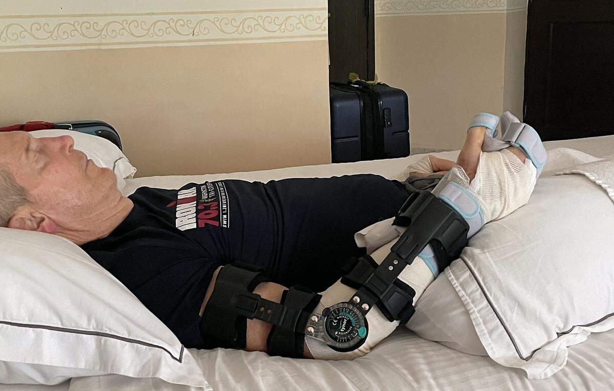 Eric Greager rests in a Mexico hotel room after a vicious crocodile attack while swimming in the ocean in front of his hotel in Cozumel, Mexico. 