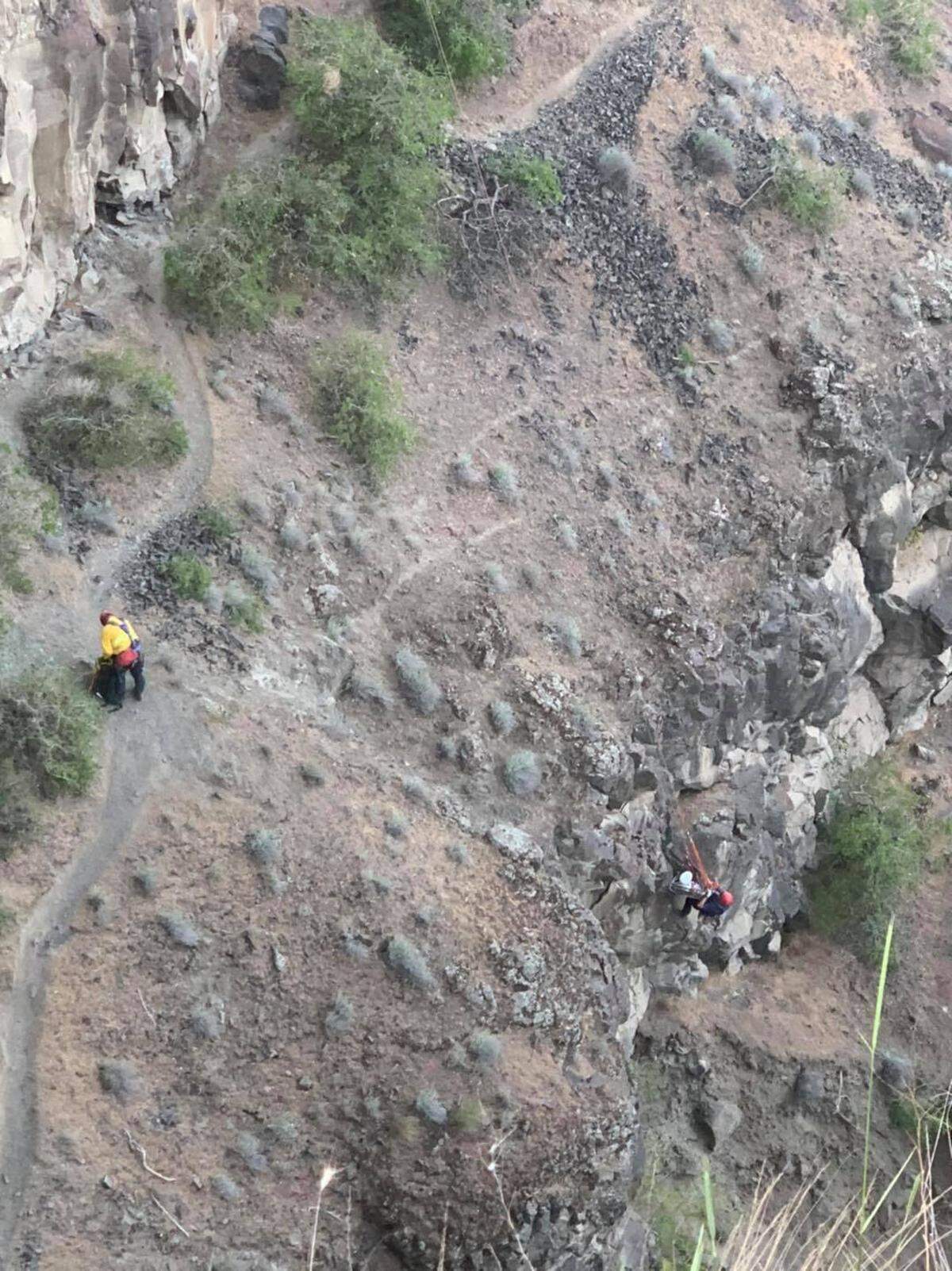 Emergency crews with Franklin County Fire District 3 and other agencies work to rescue a hiker at Palouse Falls.