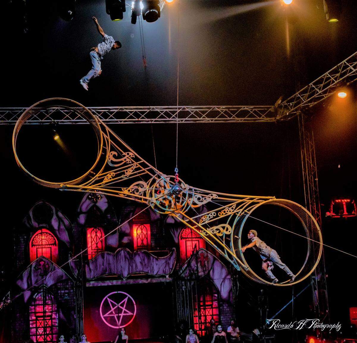 Cast members Sonny Gartner and Yuzbriner Carvajal on the Wheel of Death during Paranormal Cirque, an R-rated horror-themed circus show.