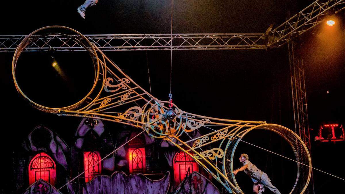 Cast members Sonny Gartner and Yuzbriner Carvajal on the Wheel of Death during Paranormal Cirque, an R-rated horror-themed circus show.